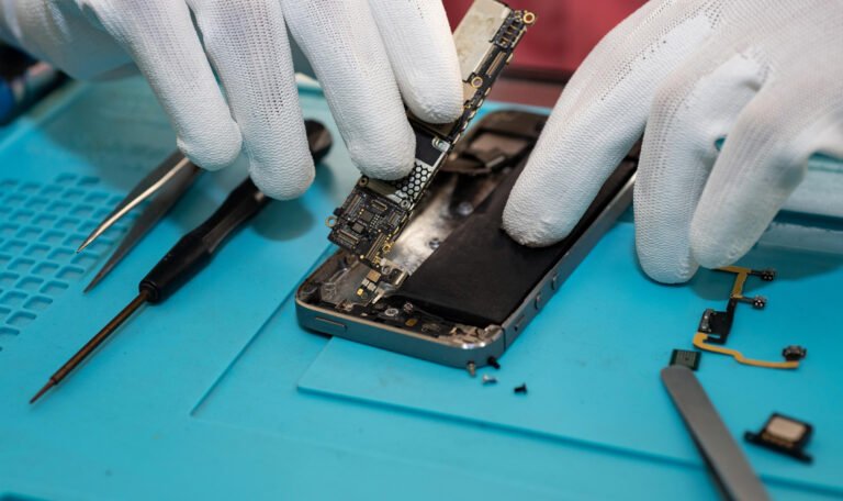 phone repair.Technician repair mobile phone in electronic smart