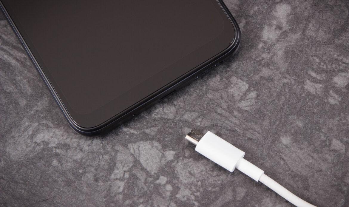 black-mobile-phone-and-unconnected-cable-of-charge