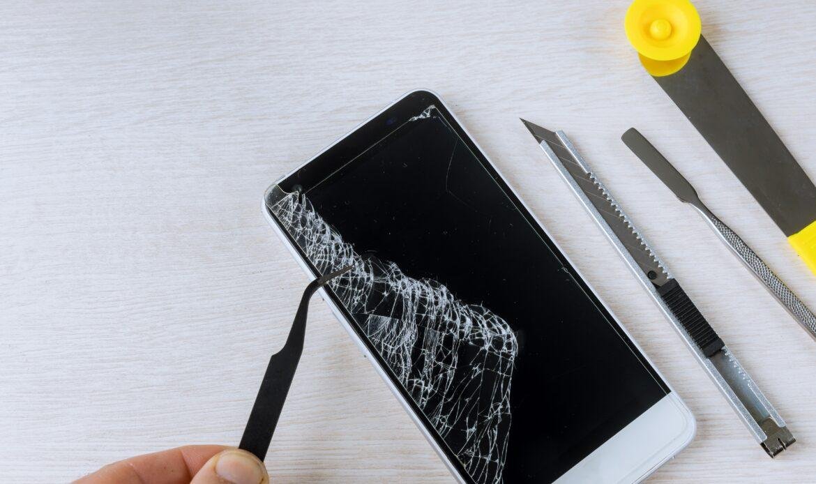 Broken phones on cracked screen