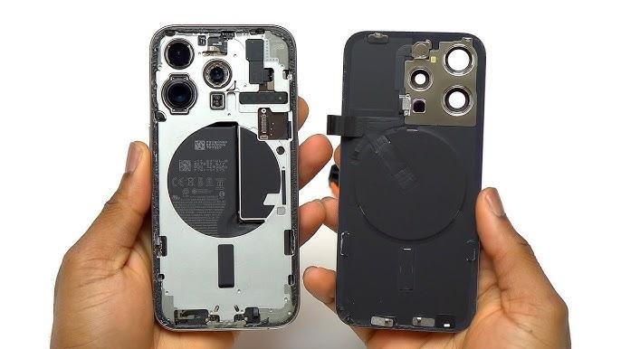 Opened smartphone showing internal components and back cover with camera module